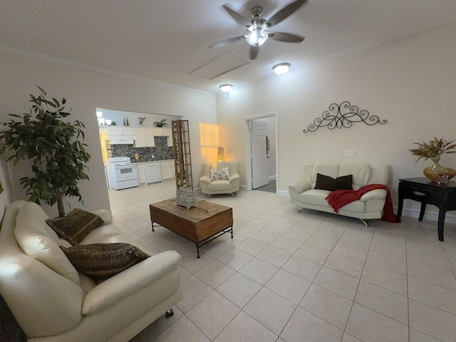 living room with light tile patterned floors, ornamental molding, and ceiling fan