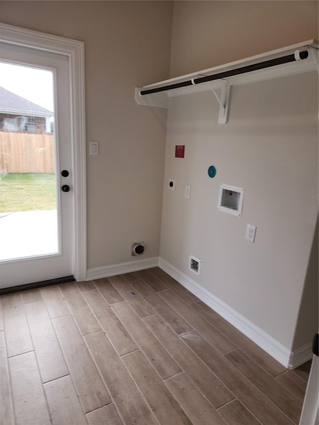 washroom featuring light hardwood / wood-style flooring, washer hookup, and hookup for an electric dryer