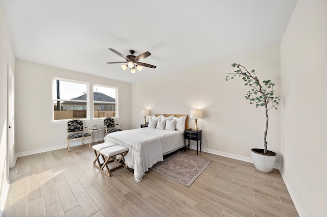 bedroom featuring light hardwood / wood-style flooring and ceiling fan