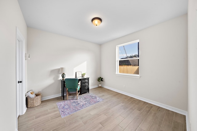 office area with light hardwood / wood-style flooring