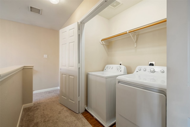 laundry area with independent washer and dryer and carpet flooring