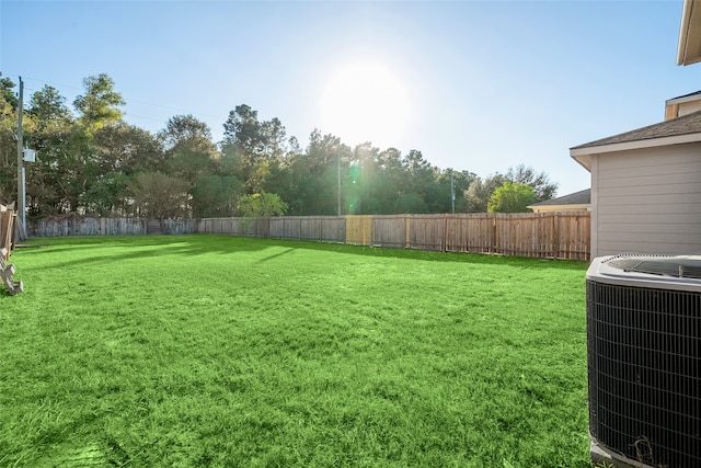 view of yard with central AC