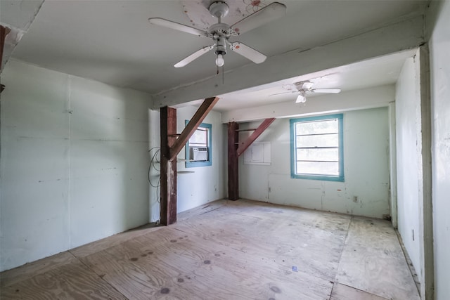 additional living space featuring ceiling fan