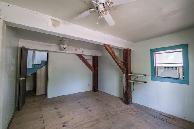 additional living space featuring ceiling fan and cooling unit