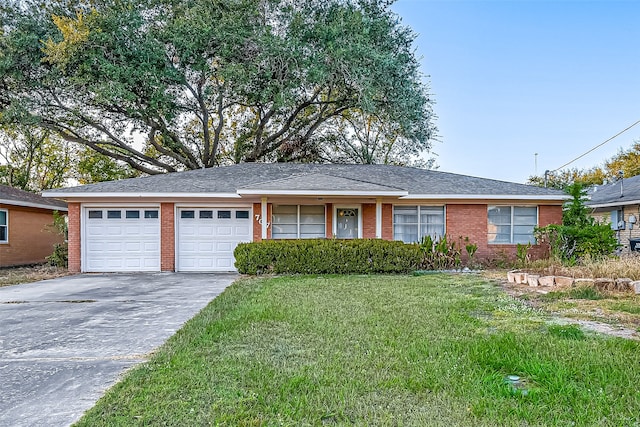 ranch-style home featuring a front yard and a garage