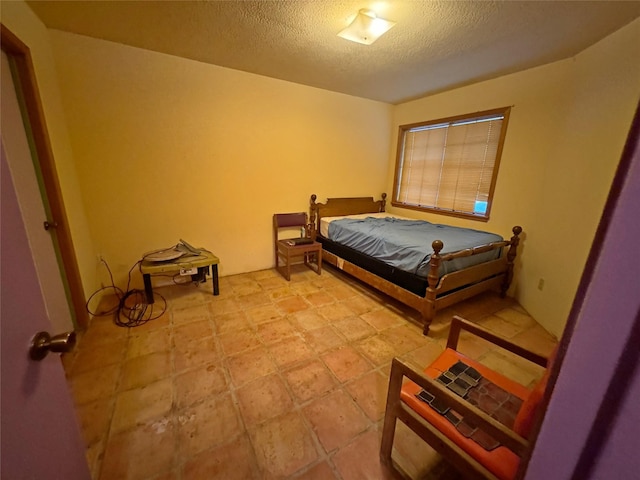 bedroom featuring a textured ceiling