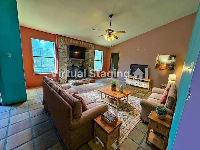 living room with vaulted ceiling, tile patterned flooring, and a ceiling fan