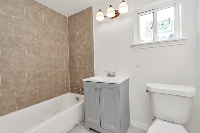 full bathroom featuring vanity, toilet, and tiled shower / bath combo