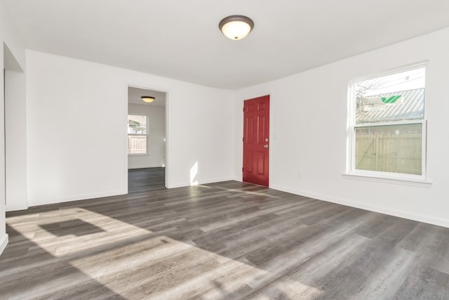 unfurnished room featuring dark hardwood / wood-style floors