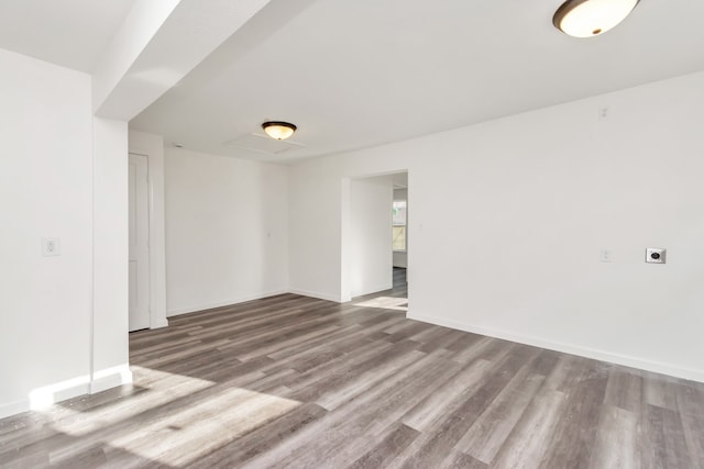 unfurnished room featuring hardwood / wood-style flooring