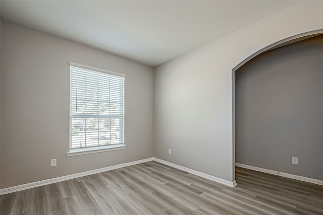 unfurnished room featuring light hardwood / wood-style floors