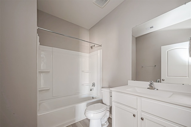 full bathroom with vanity, shower / washtub combination, wood-type flooring, and toilet