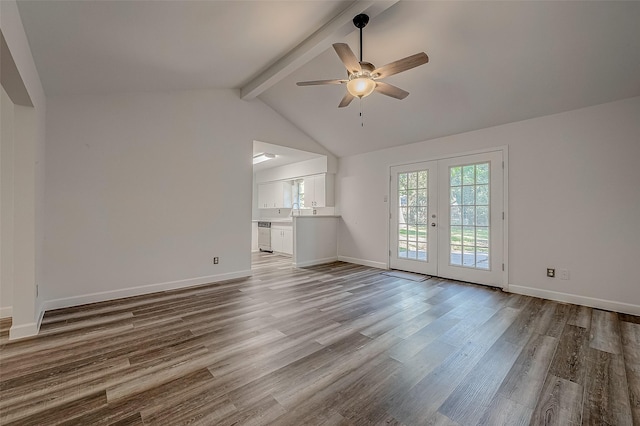 unfurnished living room featuring french doors, lofted ceiling with beams, sink, ceiling fan, and light hardwood / wood-style floors