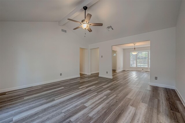 unfurnished living room featuring vaulted ceiling with beams, ceiling fan, and wood-type flooring