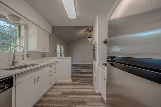 kitchen with sink, white cabinetry, and stainless steel appliances