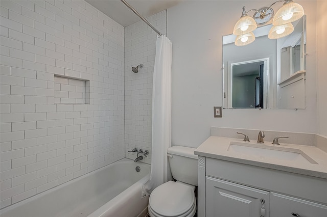 full bathroom with vanity, toilet, and tiled shower / bath