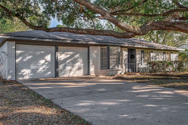 ranch-style house featuring a garage