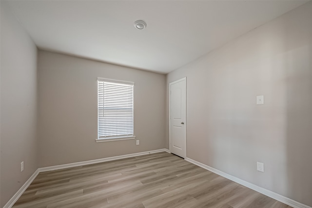 unfurnished room with light hardwood / wood-style floors