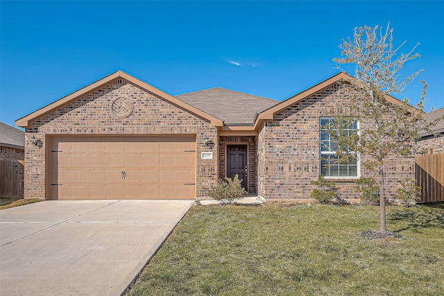 view of front facade featuring a front yard and a garage