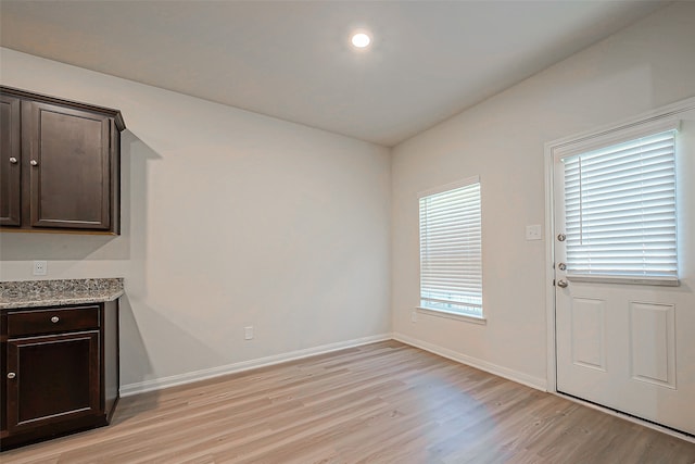 unfurnished dining area with plenty of natural light and light wood-type flooring