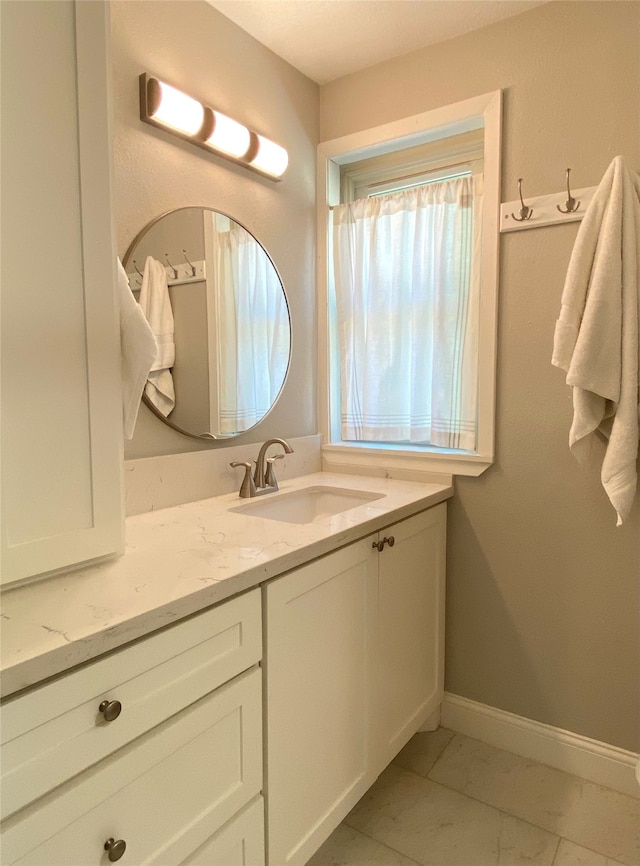 bathroom with vanity and tile patterned floors