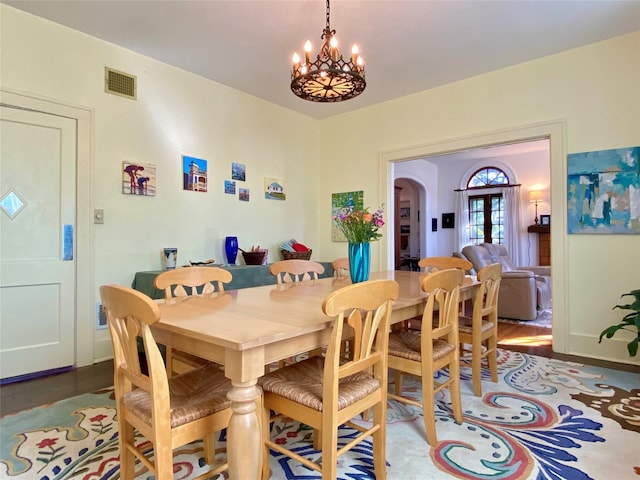 dining room featuring a chandelier