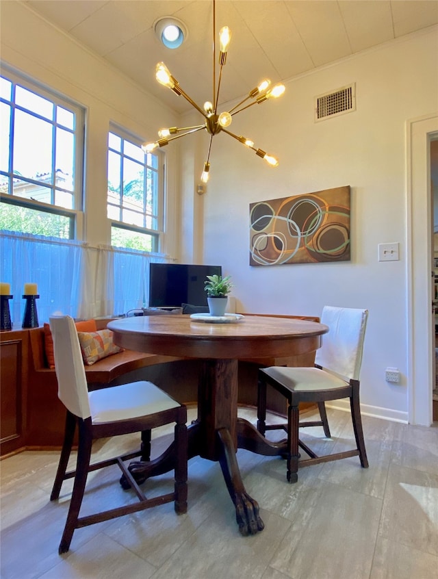 dining space with a notable chandelier