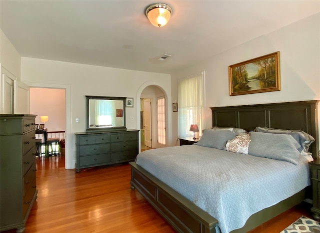 bedroom with wood-type flooring