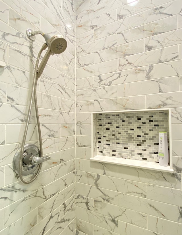 room details with a tile shower