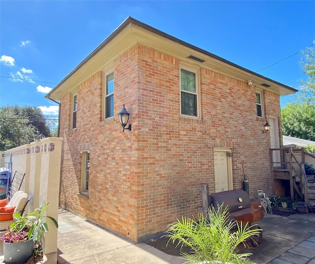 view of property exterior featuring a patio