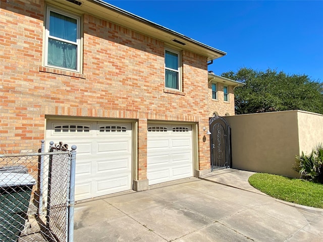 view of side of home with a garage