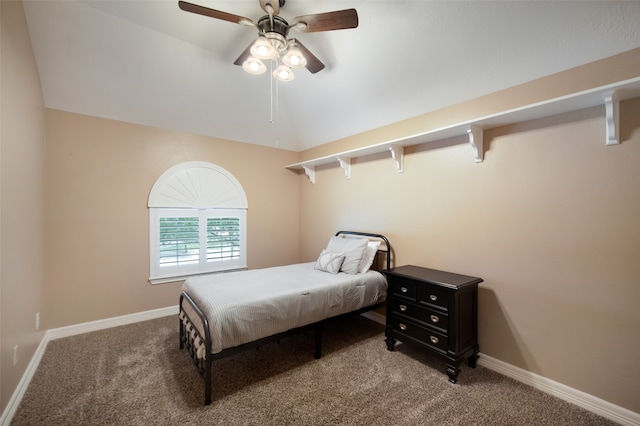 bedroom featuring carpet, vaulted ceiling, and ceiling fan