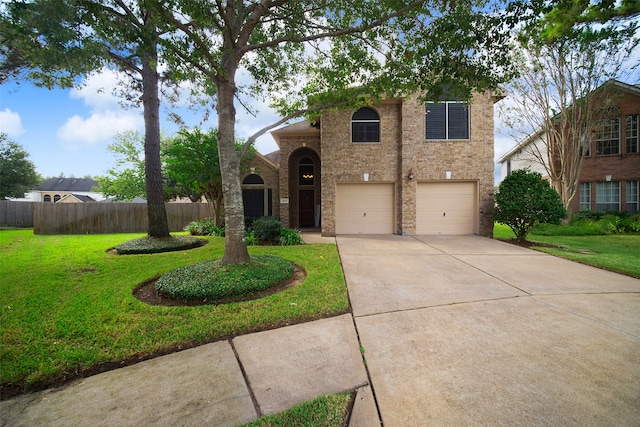 view of front of home with a garage and a front lawn