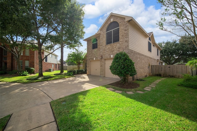 view of front of house featuring a front yard and a garage