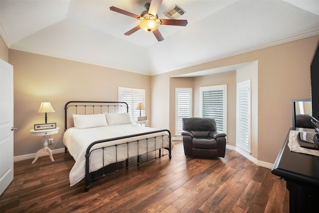 bedroom with ornamental molding, dark wood-type flooring, vaulted ceiling, and ceiling fan