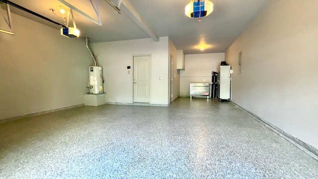 garage featuring gas water heater and a garage door opener