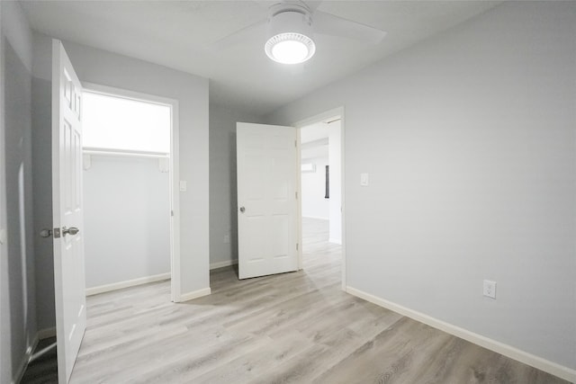 unfurnished bedroom featuring light hardwood / wood-style floors and ceiling fan