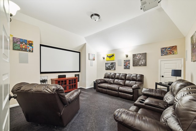 carpeted cinema with lofted ceiling