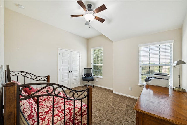 carpeted bedroom featuring ceiling fan and a closet