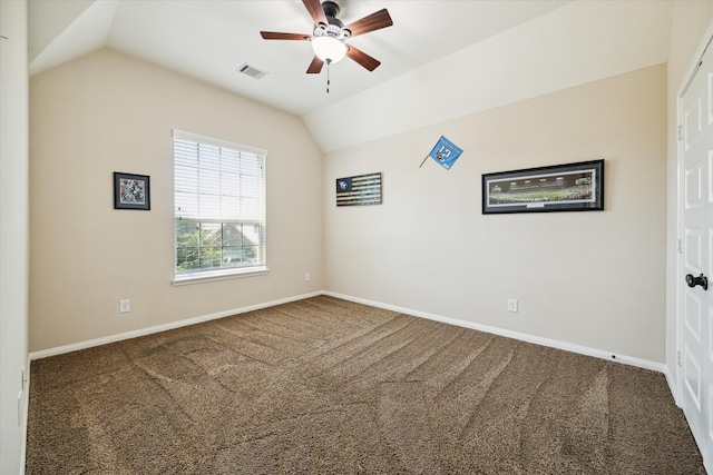 unfurnished room featuring ceiling fan, carpet floors, and vaulted ceiling