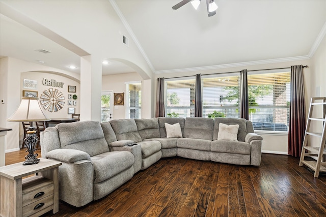 living room with ceiling fan, ornamental molding, lofted ceiling, and dark hardwood / wood-style floors