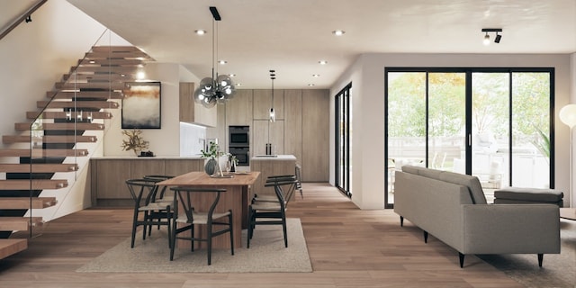 dining space with wood-type flooring