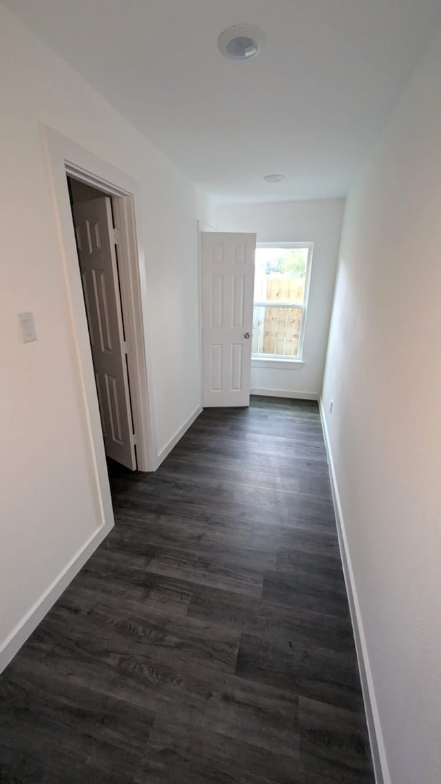 hall with dark hardwood / wood-style flooring