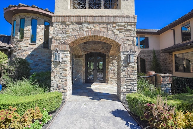 27918 Hansons Ct, Spring, TX 77386 - property entrance featuring french doors, stone siding, and stucco siding