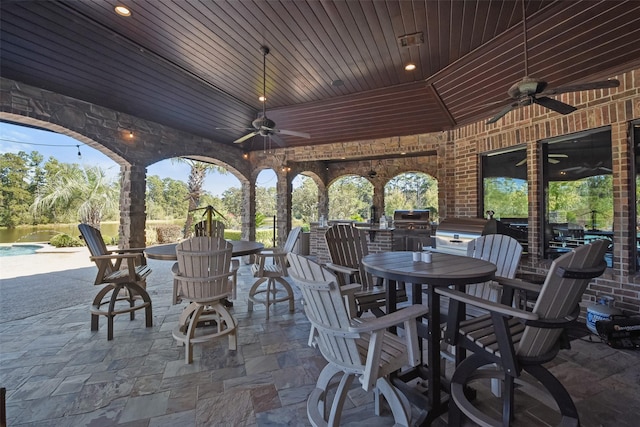 27918 Hansons Ct, Spring, TX 77386 - view of patio / terrace with outdoor dining area, a ceiling fan, an outdoor kitchen, grilling area, and an outdoor pool