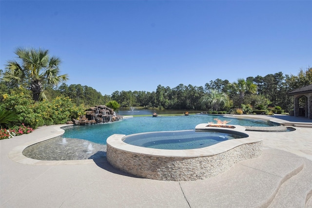 27918 Hansons Ct, Spring, TX 77386 - view of swimming pool featuring view of scattered trees and a pool with connected hot tub