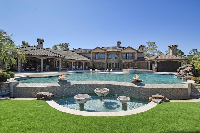 27918 Hansons Ct, Spring, TX 77386 - view of pool featuring a yard, an infinity pool, a patio area, and an in-ground hot tub