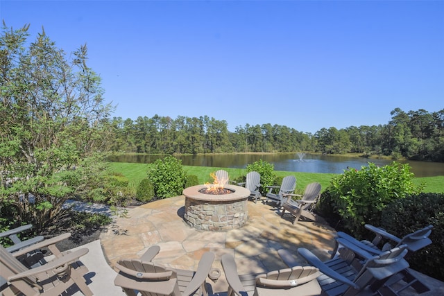 view of patio featuring a water view and an outdoor fire pit