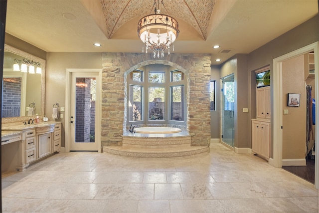 bathroom with vanity, vaulted ceiling, separate shower and tub, and an inviting chandelier