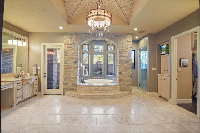 27918 Hansons Ct, Spring, TX 77386 - full bathroom featuring a bath, stone tile floors, vanity, a stall shower, and recessed lighting